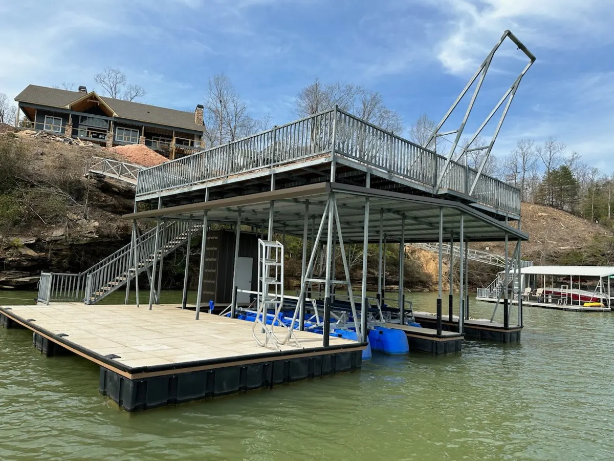 Two-story galvanized steel dock with upper entertainment deck and railed staircase on Smith Lake