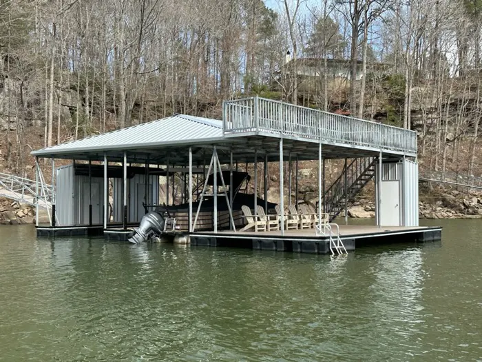 Double-slip steel dock with upper party deck, seating area, and storage rooms on Smith Lake