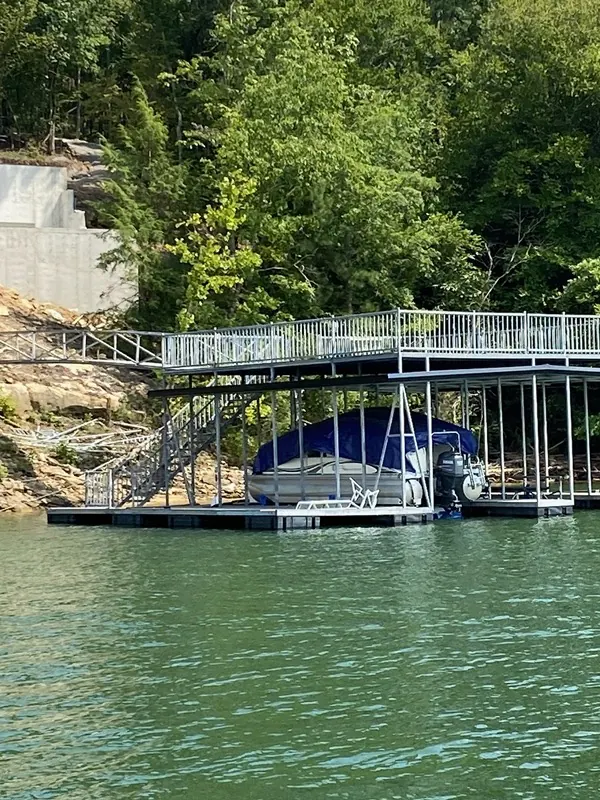 Galvanized steel dock frame with pontoon slip and shoreline stairs