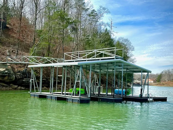 Single-slip covered boat dock with rooftop sundeck on Smith Lake